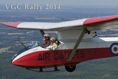 Two smiling people in open glider