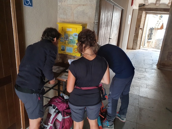 Having our pilgrim passports stamped at Cirauqui