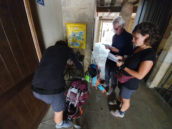 Having our pilgrim passports stamped at Cirauqui