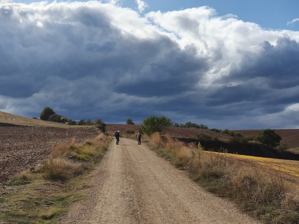 Fabrizio and Elisabeth heading into thunderstorm ahead. Halfway between Logrono and Belorado.