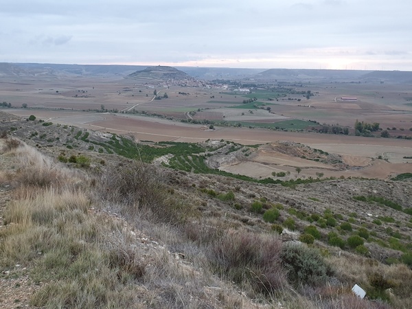 View from  "Alto de Mostelares" behind against the valley with Castrojeriz in the middle. Strange geological phenomena. Look at all the wind mills at the opposing side.