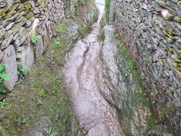 Rocky and slippery passage near Portomarin. This is where I teamed up with Elia. We also passed a brazillian pilgrim in bathing sandals.