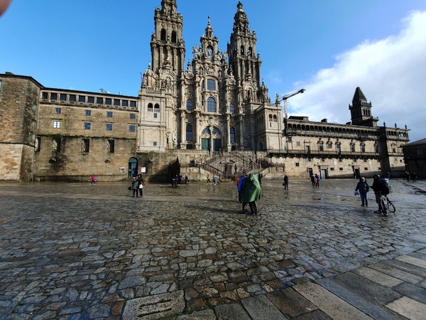 Pilgrims hugging in front of the Cathedral