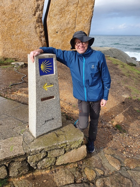 Claus at the milestone next to commemoration mark